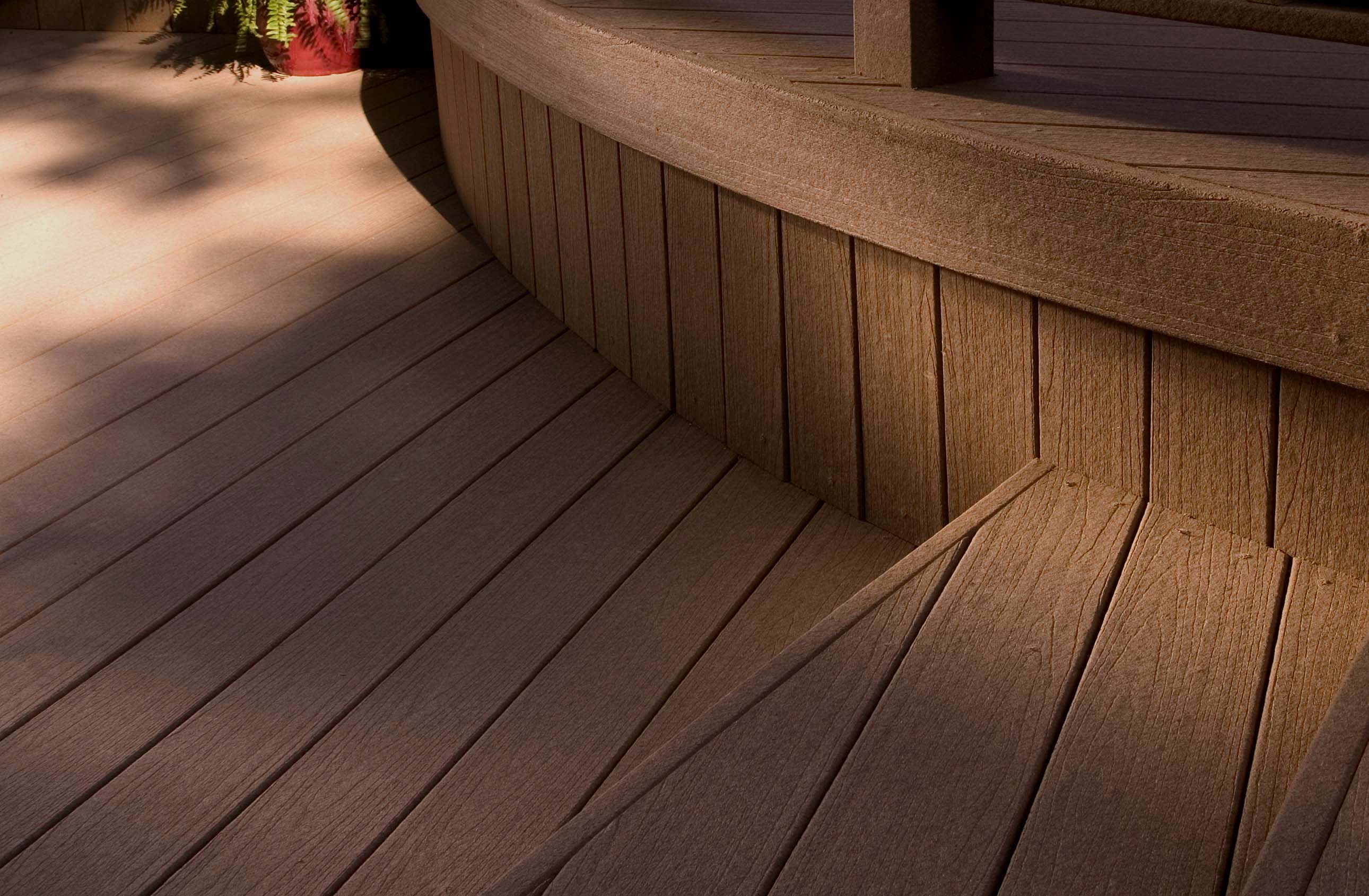 Composite deck with real wood appearance